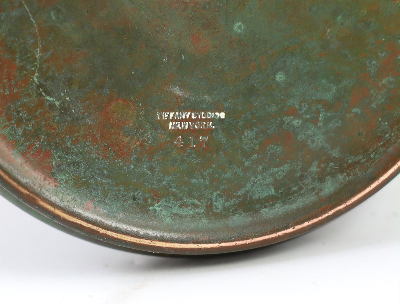 Tiffany Studios, a counter-balance patinated bronze desk lamp with ‘favrile’ glass shade, c.1905, maximum height 41cm, shade 17.3cm diameter